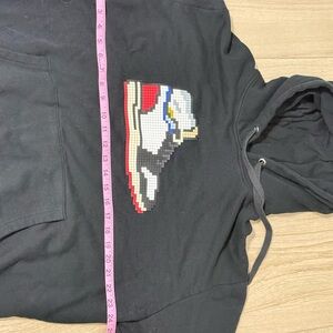 Mostly Heard Rarely Seen Black Hoodie with Pixel Jordan Sneaker Graphic $395